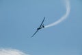 A glider flying in the blue sky ejects the water before the landing. Royalty Free Stock Photo