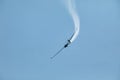 A glider flying in the blue sky ejects the water before the landing. Royalty Free Stock Photo