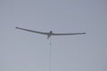 A winch launched glider soars into the sky Royalty Free Stock Photo