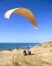 The glider pilot prepares for flight on a paraplan