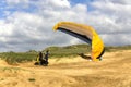 The glider pilot prepares for flight on a paraplan