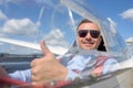 Glider pilot smiling and showing thumbs up