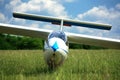 Glider plane on grass