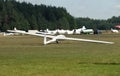 Glider plane standing on grass airport runway, at Pociunu airport, Lithuania