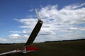 Glider plane standing on grass airport runway, at Pociunu airport, Lithuania