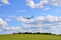 Glider, sailplane in landing, with blue clouds sky