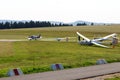 Glider sailplane towed behind a powered aircraft during takeoff on Wasserkuppe airfield