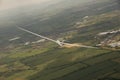 Glider turning in flight over rural England