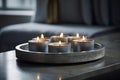 Glimmering Ambiance: Tea Light Candles on Burnished Metal Plate