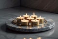 Glimmering Ambiance: Tea Light Candles on Burnished Metal Plate