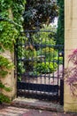 A glimpse through the gate of a spring time garden. Royalty Free Stock Photo