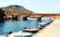 A glimpse of the bridge over the river in Bosa in Sardinia, Italy. Digital painting.