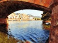 A glimpse of the bridge over the river in Bosa in Sardinia, Italy. Digital painting.