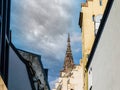 Historic Cathedral Spire Over Rooftops