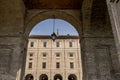 A glimpse of the Palazzo della Pilotta, Parma, Italy, framed in an arch