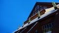 The roof with the golden statues of the church in the center of Kiruna in Sweden on a winter evening