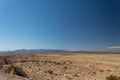 Glimpse of snow on a mountain ridge, New Mexico desert under brilliant blue sky Royalty Free Stock Photo