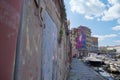 Glimpse of a Typical Livorno neighborhood in Tuscany with Venice-style waterways and Small Motor Boats Moored along the Sides,