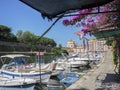 Glimpse of a Typical Livorno neighborhood in Tuscany with Venice-style waterways and Small Motor Boats Moored along the Sides,