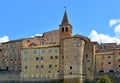 Glimpsy in old historic alley with castle stone tower in the medieval village of Anghiari near city of Arezzo in Tuscany, Italy Royalty Free Stock Photo