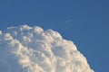 GLISTENING BILLOWING WHITE CLOUD IN BLUE SKY Royalty Free Stock Photo