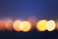 Glistening colorful city lights at night creating bokeh effect - great for abstract background