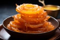 Glistening loops Indian jalebi, fried to perfection in pure ghee, selectively focused