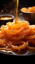 Glistening loops Indian jalebi, fried to perfection in pure ghee, selectively focused