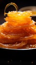 Glistening loops Indian jalebi, fried to perfection in pure ghee, selectively focused