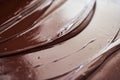 Glistening melted chocolate spread out on a table Royalty Free Stock Photo