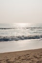 Glistening waves on beach