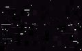 Glitch digital concept. White random shapes on dark backdrop. Glitched lines and blocks. Video distortion effect