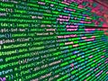 Glitch effect on LCD screen. Website codes on computer monitor. Source code photo. Data bits computer bits, shadow and dark Royalty Free Stock Photo
