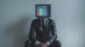 Glitching television head of a businessman represents a surreal digital identity metaphor Royalty Free Stock Photo