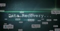 Glitchy Data Recovery text animating in cybersecurity interface, with segmented green progress bar Royalty Free Stock Photo