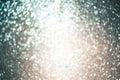 Glitter blue defocus light. Blue with beige sequins background Royalty Free Stock Photo