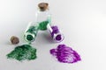 Glitter bottles spilled on a white background with copy space. Concept of glitter sales ban in Europe