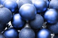 Glitter Christmas balls blue background. Holiday decoration Royalty Free Stock Photo