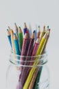 Glitter colored pencils in a glass jar Royalty Free Stock Photo