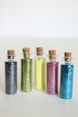 shiny glitter in bottles isolated on white background