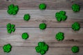 Glitter Covered Four Leaf Clovers in a Pattern on a Wood Background Royalty Free Stock Photo