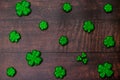 Glitter Covered Four Leaf Clovers in a Pattern on a Wood Background Royalty Free Stock Photo