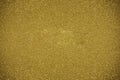 Glitter dark yellow background. Photo of monotone shiny background