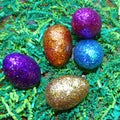 Glitter Easter Eggs in green grass.