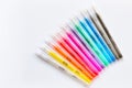 Glitter gel pens bright vivid colors on white paper background Royalty Free Stock Photo