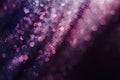 Glitter and glow soft multi colored bokeh shining . Dark abstract dreamy wunderful sparkle background.