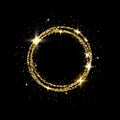 Glitter gold circle frame with space for text. Sparkling golden frame on black background. Bright glittering star dust Royalty Free Stock Photo
