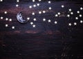 Glitter golden stars and glass moon on grunge wood Royalty Free Stock Photo