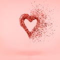 Glitter heart dissolving into pieces on pink background. Valentines day, broken heart and love emergence concept . Living coral Royalty Free Stock Photo