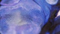 Glitter ink blob paint mix blue purple fluid blend Royalty Free Stock Photo